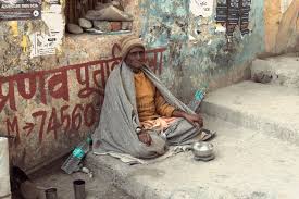 An Old Indian Beggar Waits for Alms on ...