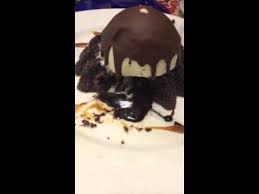 The moist chocolate cake with a gooey center topped with melty vanilla ice cream and chocolate shell topping. Chili S Molten Lava Cake Youtube