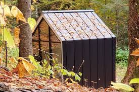The roof design is influenced by. This Tiny Cabin Shaped Like The Home Icon Features Floor To Ceiling Facades For Nature Lovers Yanko Design