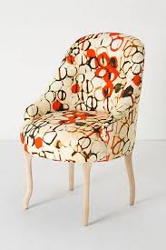 The Sirkler Pull Up Chair Was Created By Sherry Olsen For Anthropologie I Love The Pops Of Orange Mixed With The Cream Painting Fabric Chairs Furniture Chair