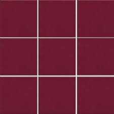 The floor is a standard concrete floor that was poured in place with a smooth finish. Ral Burgundy Tobacco Italia Ceramics
