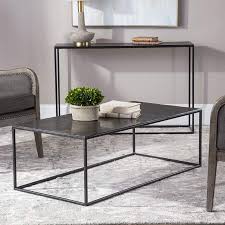 This modern table is framed by an iron base, complete with a mango wood tabletop. Uttermost Coreene 48 Wide Aged Black Iron Coffee Table 72w20 Lamps Plus