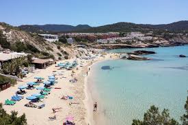 A Very Long Strip Of White Sand Sheltered By Hills Cala Tarida Is Well Facilitated And Family Oriented Ibiza Ibiza Formentera Ibiza Travel Ibiza Spain