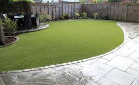 Crazy paving lies beneath the pergola that is covered by clear polycarbonate roofing we have been paving with concrete and asphalt for over 20 years i. Artificial Grass And Turf Hampshire Gemini Landscapes Artificial Grass Backyard Backyard Landscaping Patio Garden Design