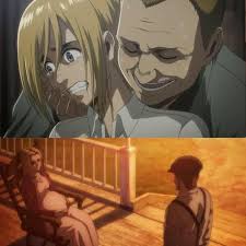 Erwin mirando fijamente al Titán Acorozado sin miedo alguno, una toma épica.