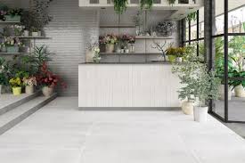 Because the concrete beneath the carpet was not flat and it had a hump in the middle of it, we had to lay underlayment before we could begin with the tiles. White Concrete Floor Tiles Full Body Porcelain Stoneware Matt