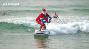 Australia kangaroo merry christmas jumping australian emoticon. Santa Surfing Gif By The Telegraph Find Share On Giphy