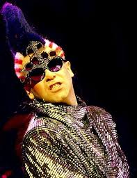 Elton John S Outfits Through The Years Elton John Elton John Quotes Elton John Costume