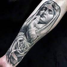 The holy prayer is inked onto the skin of the wearer with the rosary surrounding it. Top 101 Virgin Mary Tattoo Ideas 2021 Inspiration Guide