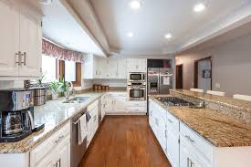 This photo shows the former dark cabinets, which the homeowners felt made the kitchen look dreary. Refinish Oak Kitchen Cabinets In Naperville Illinois Wheatland Custom Cabinetry Woodwork