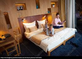 To make it a true couple's staycation, do at spend an entire night camping out in your living room by your fire…or if you're really adventurous (and the weather you might even set aside a little of your staycation time to brainstorm ideas for the next time you can travel further afield. Young Couple In Modern Hotel Room Royalty Free Image 14910453 Panthermedia Stock Agency