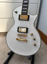 NGD! Picked up this beautiful EC1000T for a steal. Absolutely mint with the  gorgeous Ebony board, full thickness body and DiMarzio PAFs. Looks great  with my KH3 too!