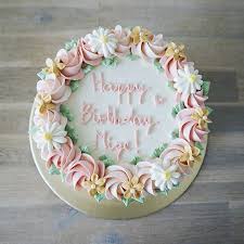 Our signature floral birthday cake may look good enough to eat, but don't it's actually crafted from fresh flowers such as mini carnations and poms! Birthday Cake Floral Cake Design Cake Cake Decorating