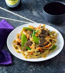 This beef lo mein combines tender beef, onions, peppers, carrots, celery, cabbage, snow peas and rice noodles in a slightly spicy ginger soy sauce. Beef Lo Mein Fox Valley Foodie