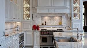 It can be difficult to use brick and metal cabinets together, but the white cabinets and white farmhouse sink have made this transition easy. Antique White Cabinets Transitional Kitchen Drury Designs