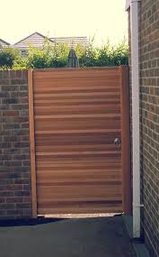 An Outdoor Wooden Gate Can Add A Charm Wooden Gate Designs Wood Gate Outdoor Gate