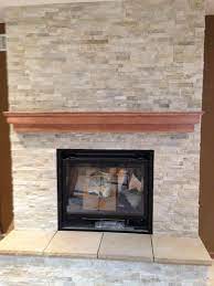 Add Tile Or Stone To Update An Existing Fireplace Like These Earthstone Coverings Stone Veneer Fireplace Fireplace Home