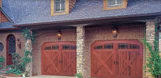 They moved our shower, changed the cabinetry, installed floor tile and floor to ceiling tiles in the new shower area as well as adding a bench, removed popcorn ceiling, added can light, changed the door, and installed a sun tube. Wood Garage Doors In Minneapolis Mn Residential Garage Doors