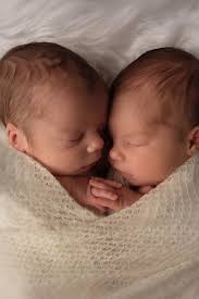 Twins form a heart shape