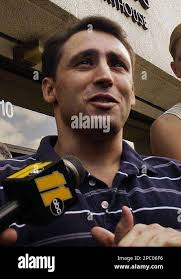FILE ** Former CIA contractor David Passaro speaks to the media in front of  the North Carolina Federal Building in this Friday, Aug. 27, 2004 file  photo in Raleigh, N.C. Passaro