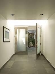 Example Of A Minimalist Entryway Design In Los Angeles With White Walls A Double Front Door A Met Modern Entry Contemporary House Contemporary Interior Doors