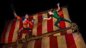 Peter Pan And Captain Hook Sword Fight On The Mast Of A Magical Pirate Ship At Peter Pan S Flight Disney Discounts Peter Pans Flight Magic Kingdom