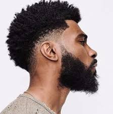 An afro haircut can bring life to the black men's look. Home