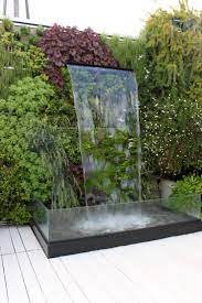 La fuente a medio hacer: Fuente De Jardin En Terraza Jardines Terrazas Paisajistas Diseno Exterior De Diseno Jardin En Terraza Fuentes Para Jardin Fuentes De Agua De Jardin