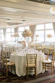 White Wedding Reception Guest Tables With Gold Chiavari Chairs Ivory Linens Floral Centerpieces Gold Chiavari Chairs Chivari Chairs Chiavari Chairs