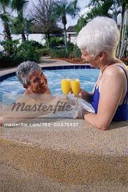 Mature Couple in Swimwear Relaxing in Hot Tub with Drinks - Stock Photo -  Masterfile - Rights-Managed, Artist: Brian Sytnyk, Code: 700-00075437