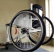 spinergy xslx cross laced sport light extreme wheelchair wheels on a custom built box chair featuring white spokes black axle so durable 車