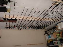 It holds 4 on each side and 2 tackle bags underneath. Ceiling Rod Rack Ideas Www Thehulltruth Isaac Miller Ceiling Ideas Isaac Miller Rack Rod Wwwth Fishing Rod Storage Rod Holder Fishing Rod Holder