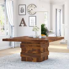 The design of this refined mountain home is rooted in its natural surroundings. Modern Simplicity Rustic Wood Square Dining Room Table With Storage