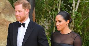Meghan markle with prince harry, wearing a stella mccartney coat, hiut jeans and a demellier london handbag. Meghan Markle Sparkles On Lion King Premiere Red Carpet With Prince Harry Flipboard