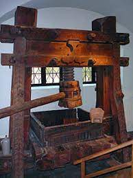 A printing press is a mechanical device for applying pressure to an inked surface resting upon a print medium (such as paper or cloth), thereby transferring the ink. Printing Press Wikipedia