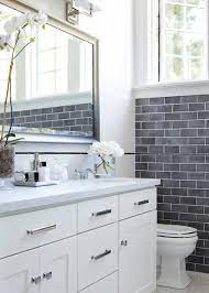 The floor features an intricate herringbone pattern of rectangular tiles, bordered in black, white, and gray. Gray And White Bathroom Houzz
