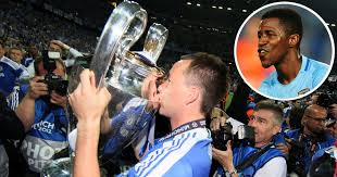 John terry wearing full chelsea kit including boots, shin pads and even sock tape to collect the champions league trophy in 2012, despite being suspended for the final, has become one of football's biggest oddities over the years. The Idea Came From The Club Ex Blue Ramires Explains Why John Terry Wore Full Kit To Lift Uefa Champions League Trophy
