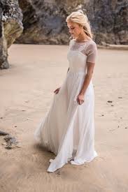 21 » lace wedding dresses are as elegant as they are timeless and graceful. Picture Of A Romantic Flowy A Line Wedding Dress With An Illusion Neckline And Sleeves Lace Appliques And A Flowy Skirt