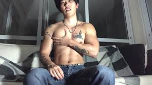 asian boy massaging muscles and jerking off