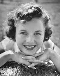 Who is the actress, singer, and businesswoman with a 1950s hit song?