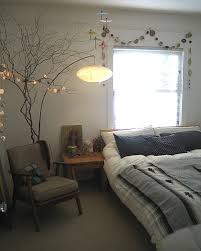 Love The Tree Branch With Lights And The Lovely Garland Over The Bed Master Bedrooms Decor Wall Decor Bedroom Beautiful Bedrooms