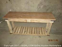 In addition to its beautiful tabletop, a planked shelf underneath allows for lots of extra storage. World Market Cameron Console Table Please Preview Auction Bidrl Com Online Auction Marketplace