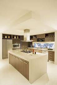 Kitchen has marble countertops with a gas/electric oven open to the lounge area. How To Choose A Kitchen Countertop