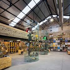 Raccoon Games Interior In Seville By Serrano Baquero Store Design Interior Comic Book Storage Adventure Store