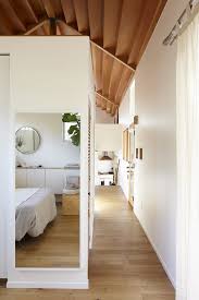You can tell there is a door near the bottom of the picture, though any. Photo 1 Of 931 In Bedroom Medium Hardwood Photos From This Bright And Airy Backyard Cottage In Los Angeles Feels Like A Cabin In The Woods Dwell