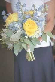 Band of colored paper, ribbon on top. Blue And Yellow Wedding Bouquet Perfect For The Bride Or Bridesmaid Designed With Blue Hydra Yellow Wedding Flowers Wedding Bouquets Pink Yellow Rose Wedding