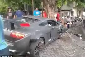 The lamborghini was a total loss. Lamborghini Driver Hangs Out Of His Car Texting After Fatal Crash In East Java Daily Mail Online