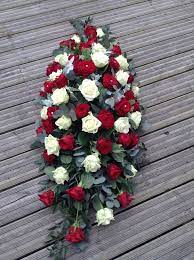 Free delivery to all funeral homes on all items over $69.00. Red And White Rose Casket Spray Red And White Rose Coffin Spray Funeral Flowers Funeral Floral Arrangements Casket Sprays