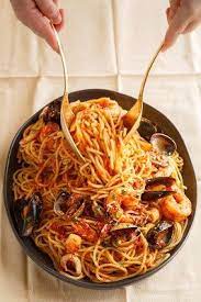 Four types of seafood are tossed together and baked with a cheesy white sauce. The Best Seafood Recipes For Christmas Eve Best Seafood Recipes Seafood Recipes Seafood Marinara Recipe