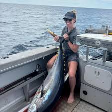Nicola with another solid Yellow Fin. The girls are